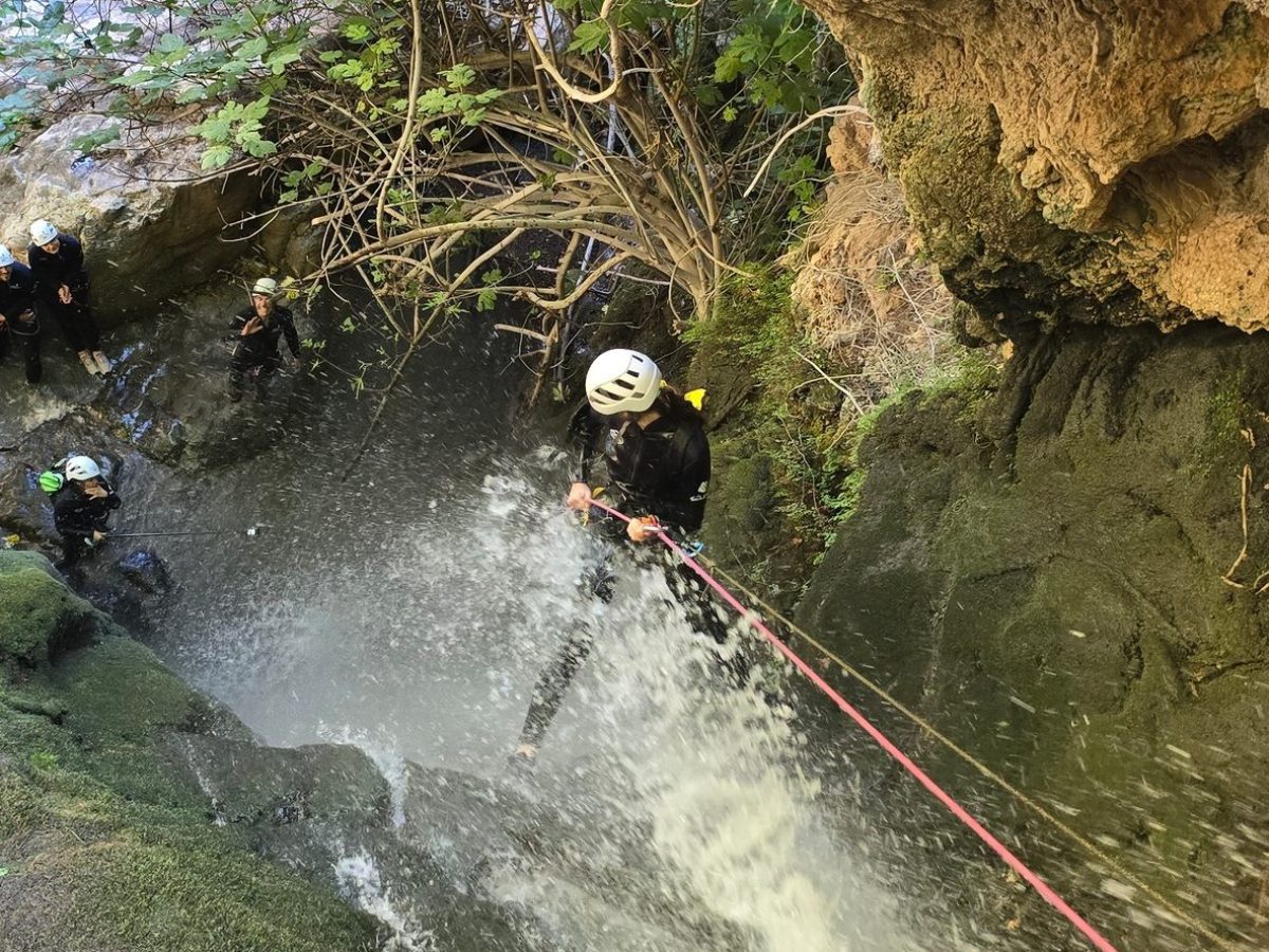 a large waterfall over some water