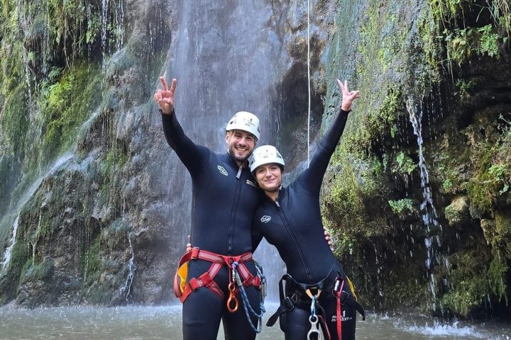a person standing next to a body of water