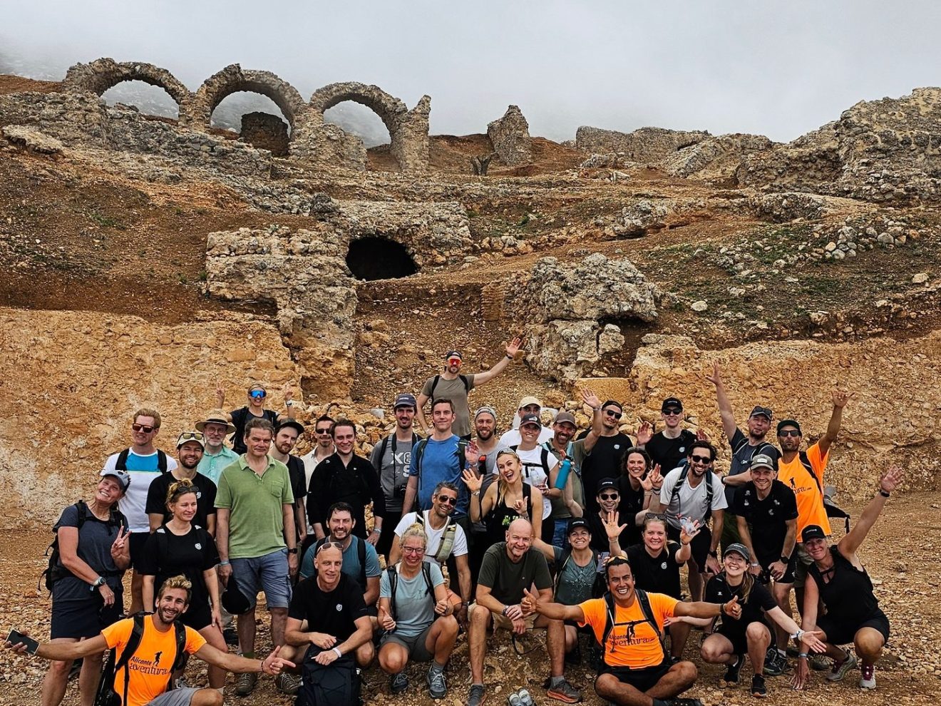 a group of people on a rocky beach