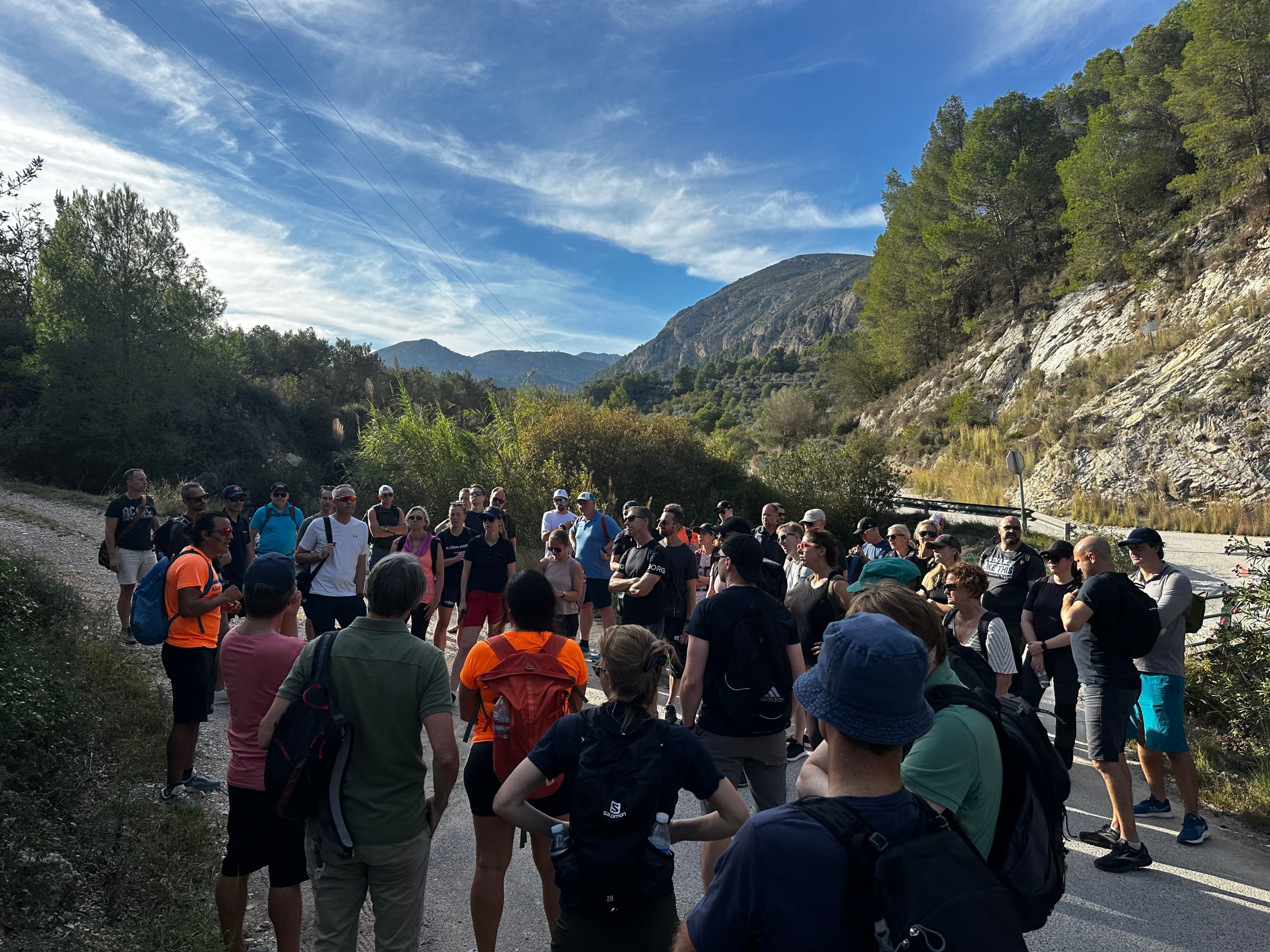 a group of people standing in front of a crowd