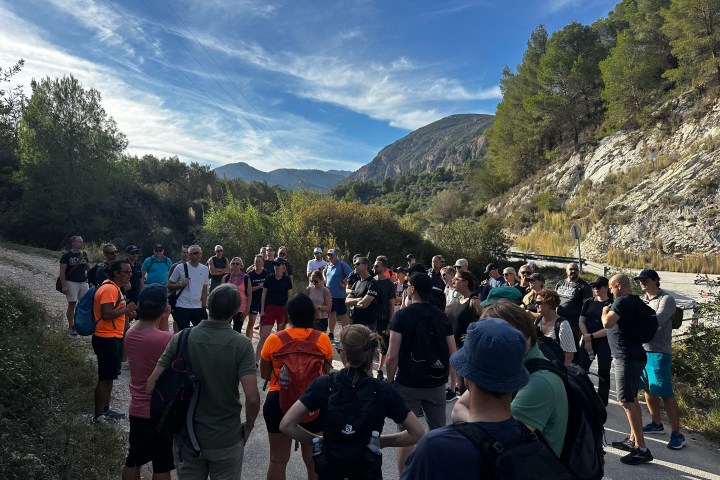 a group of people standing in front of a crowd