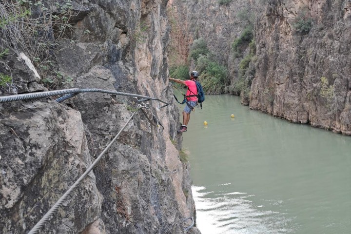 a man riding on top of a rock