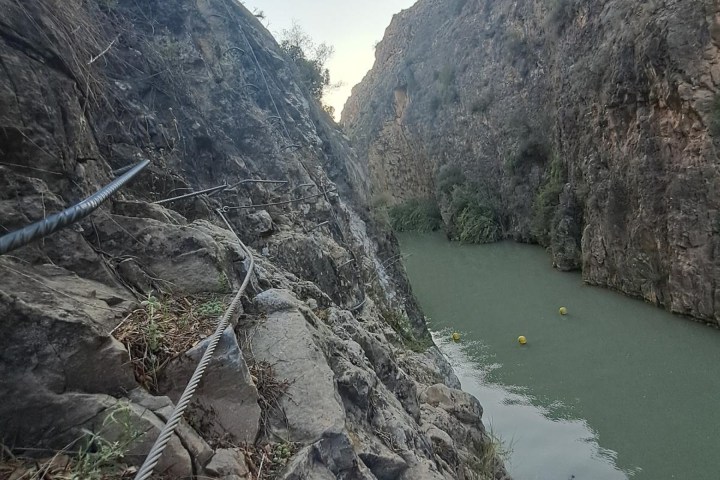 a body of water with a mountain in the background