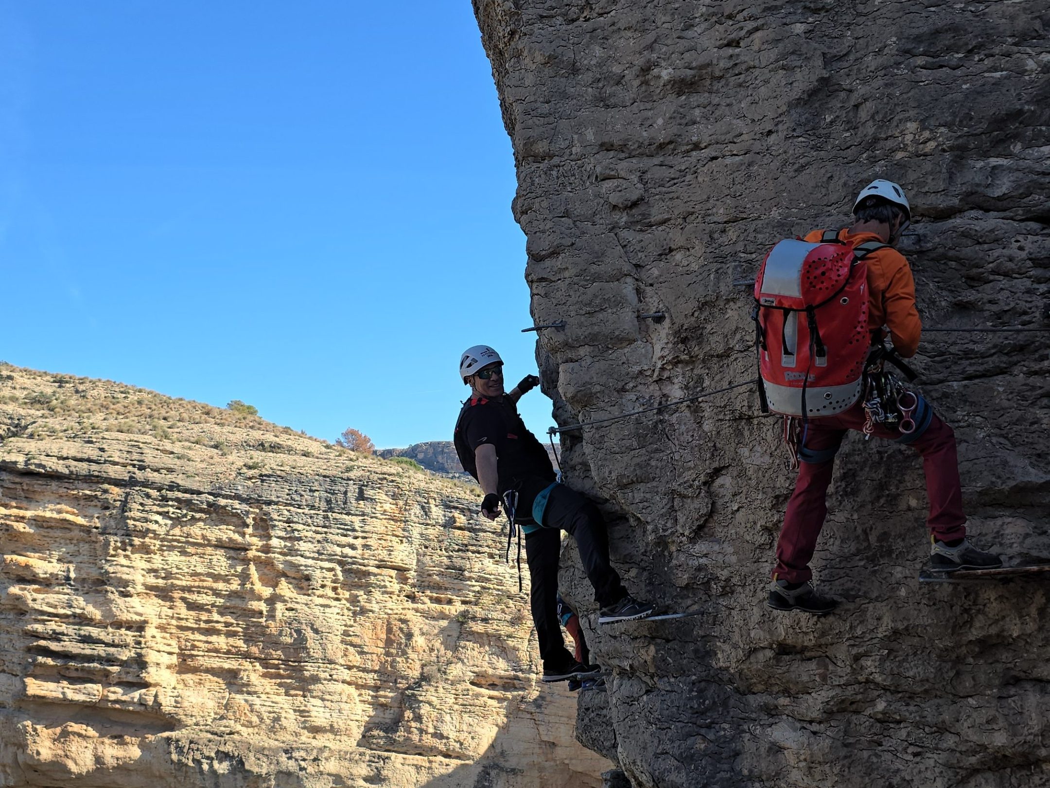 a man standing on a rocky hill