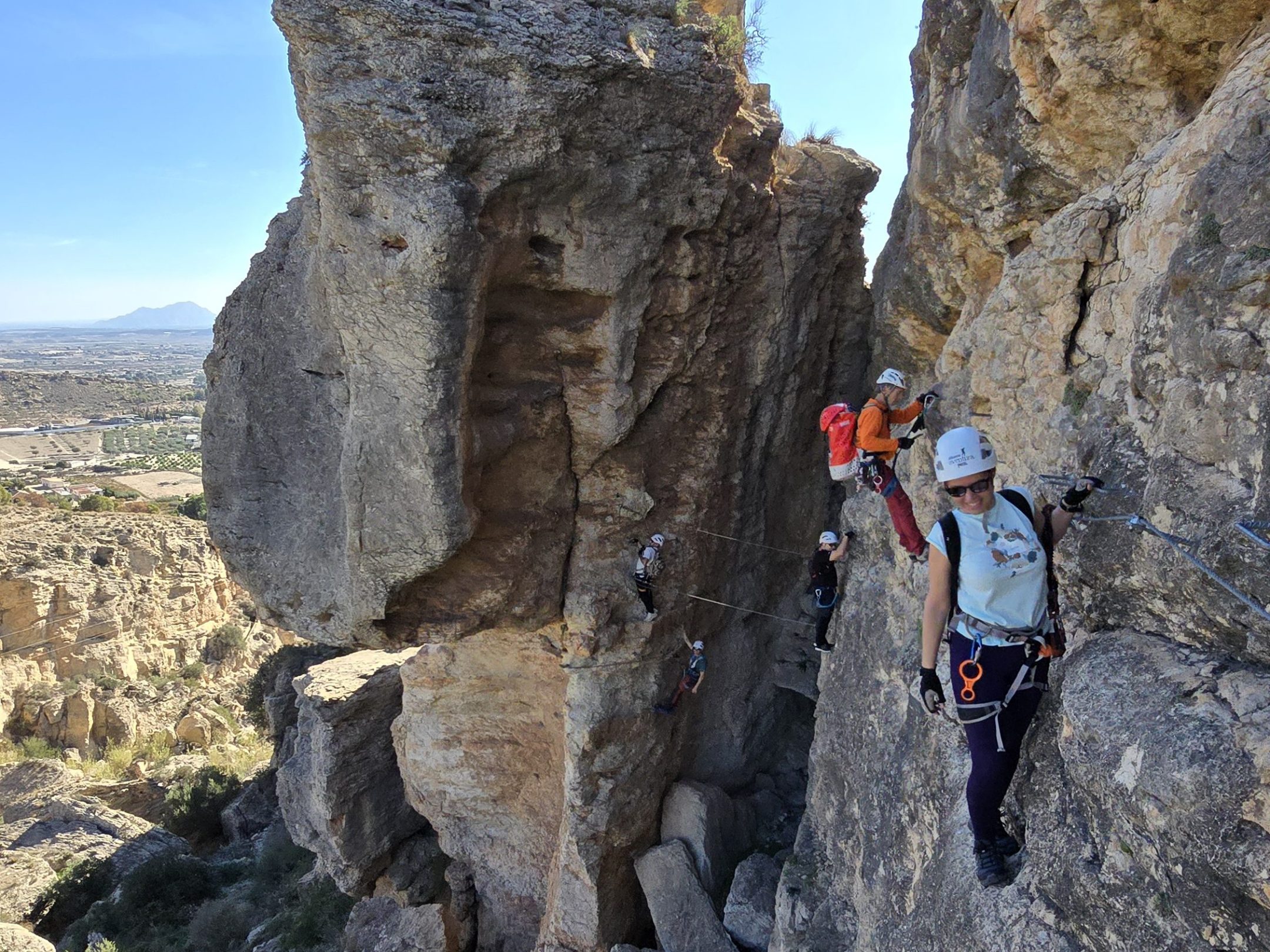 a group of people on a rocky hill