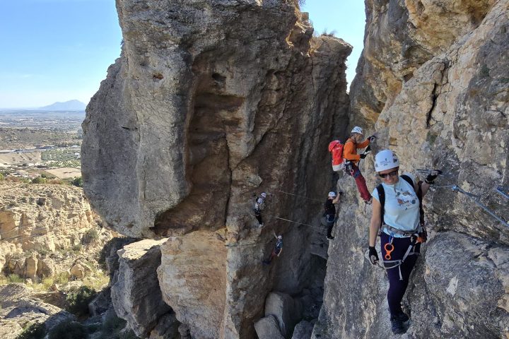 a group of people on a rocky hill