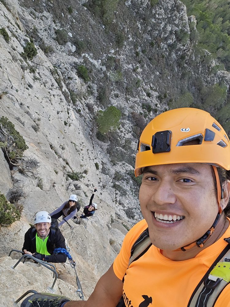 a man standing in front of a mountain