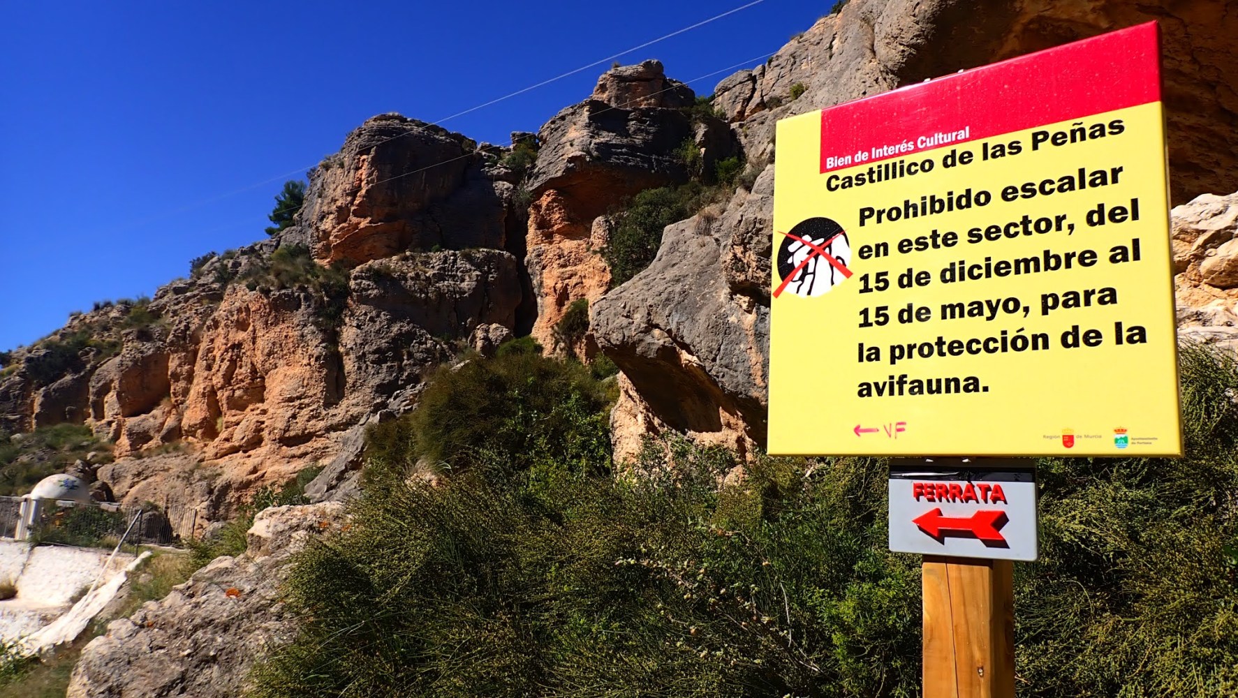 a sign on the side of a mountain