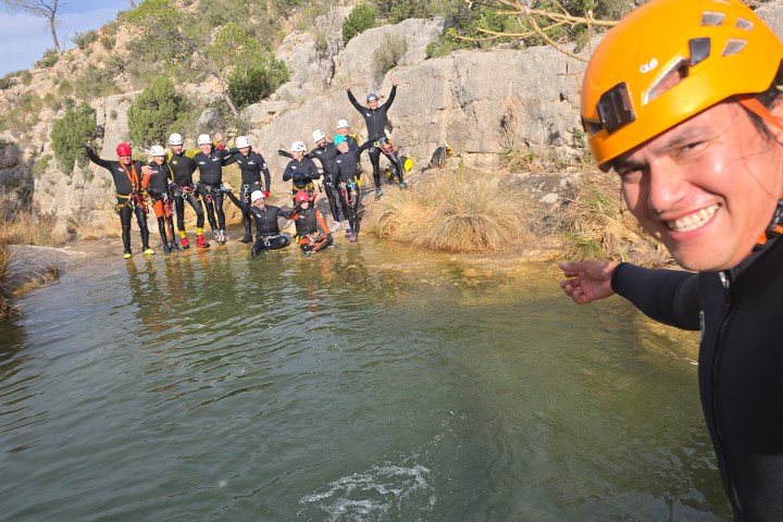 a group of people on a raft in the water