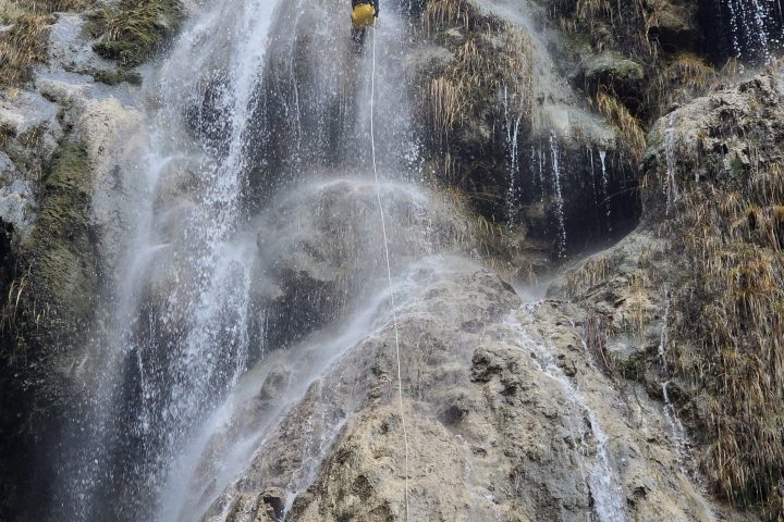 a waterfall into a body of water