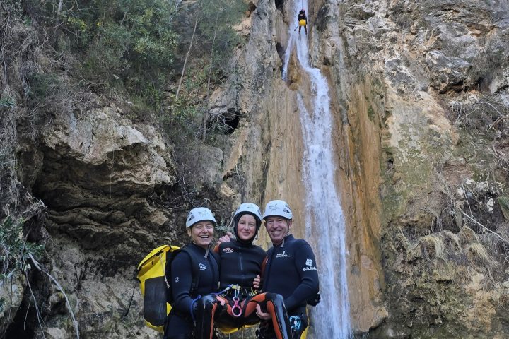 a man riding a motorcycle down a river