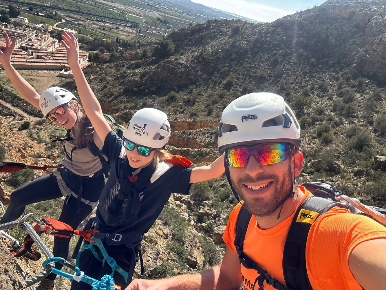 a group of people standing on top of a mountain