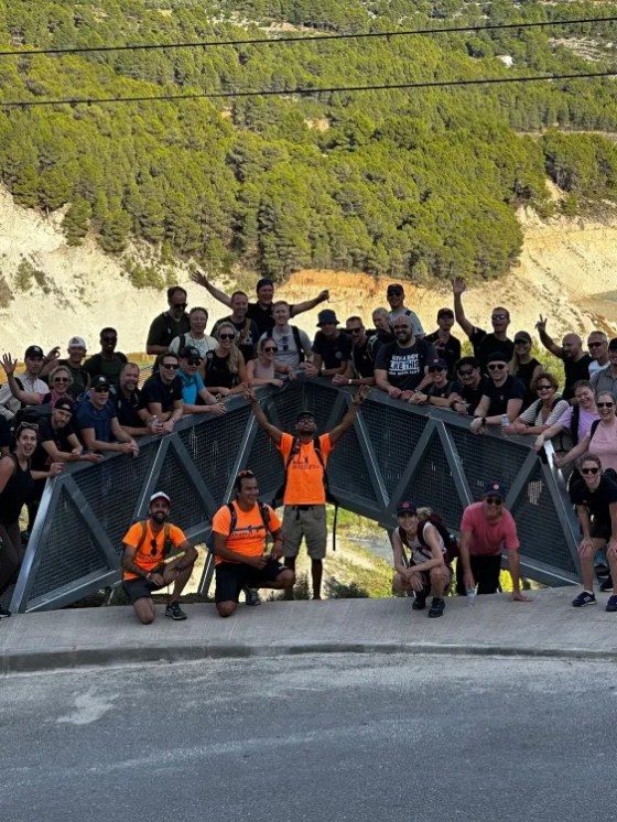 a group of people on a mountain road