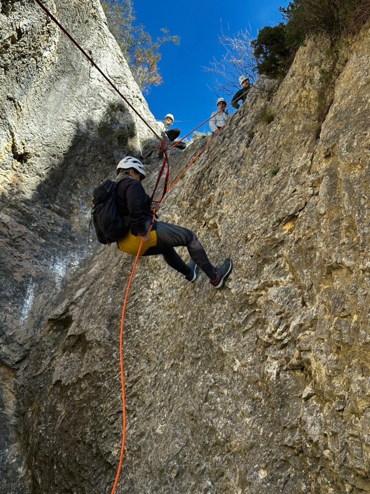 a man standing on a rock in El Sord Canyon