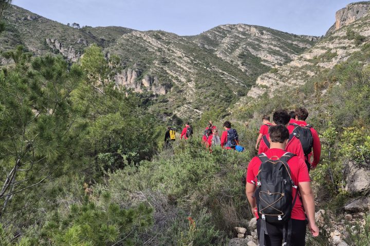 a man standing in front of a mountain