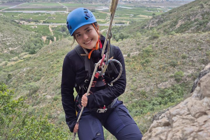a person standing on a rocky hill