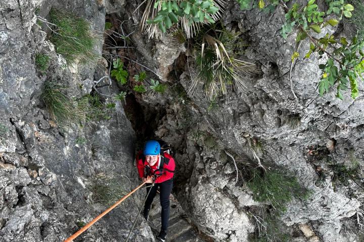 a person riding on top of a rock