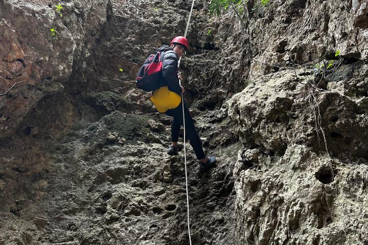 a person flying through the air while riding a bike down a dirt road