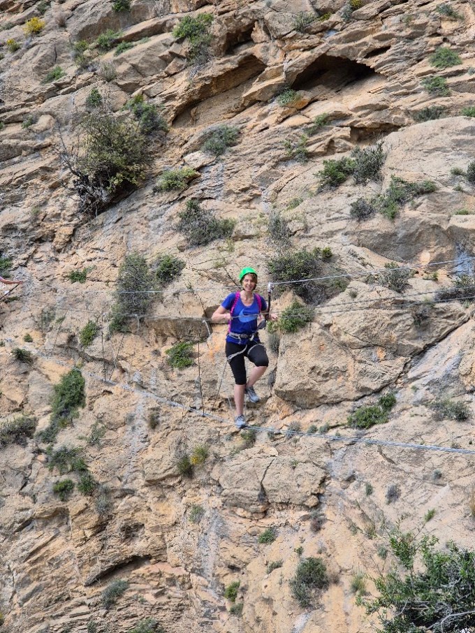 a man standing on a rocky hill