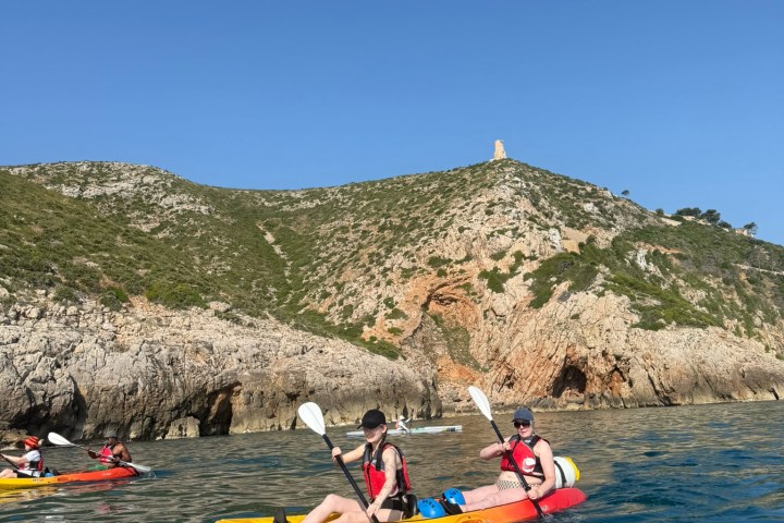 a group of people on a boat in the water